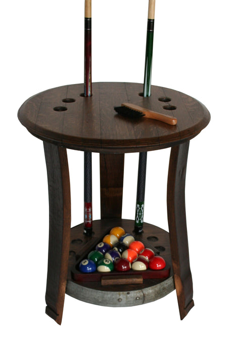 Wine Barrel Pool Cue Rack made from reclaimed wine barrel stave. Holds 6 pool stick and 1 rack of pool balls. This pool cue rack is stained in pine and has an upper shelf and lower shelf. The lower shelf has metal accents around the outside .