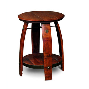 Wine Barrel Side Table Made from Reclaimed wine barrel staves. The table is 28 inches tall and 23 inches in diameter and is stained in pine. It has a lower shelf for storage. The item is made by hand in America by 2 Day Designs