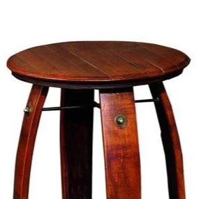 Wine Barrel Side Table Made from Reclaimed wine barrel staves. The table is 28 inches tall and 23 inches in diameter and is stained in pine. It has a lower shelf for storage. The item is made by hand in America by 2 Day Designs